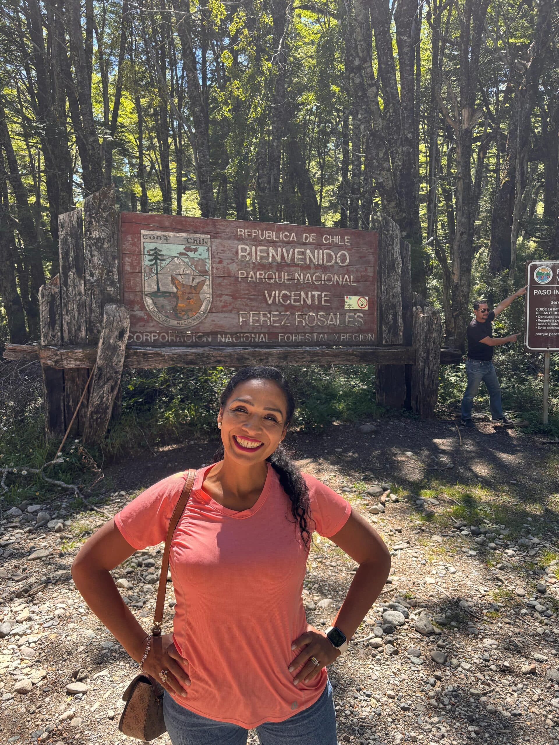 Gisella at the entrance sign of Vicente Perez Rosales National Park, Chile